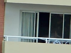 girl nude in balcony argentina far away ( 200 m)