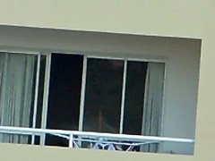 girl nude in balcony argentina far away ( 200 m)