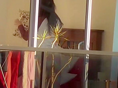 secretly spies on his neighbor