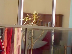 secretly spies on his neighbor