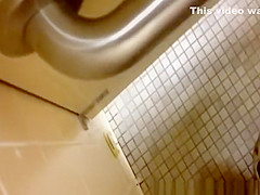 strokes cock while woman peeing